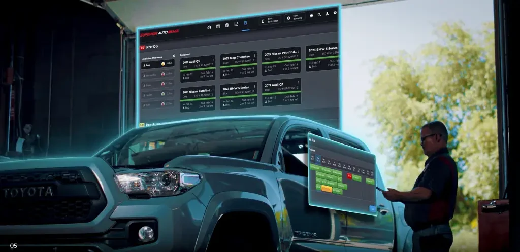 A technician using the Vaultoniq app in the bay